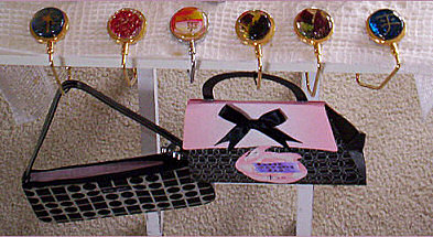 Purse hangers on table